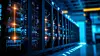 Row of network servers with glowing LED lights.