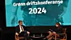 Energiminister Terje Aasland (Ap) i samtale med Mie Fuglseth under Grønn driftskonferanse 2024. Foto: Grønn Byggallianse