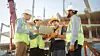 diverseteamofspecialistsuselaptopcomputeronconstructionsite